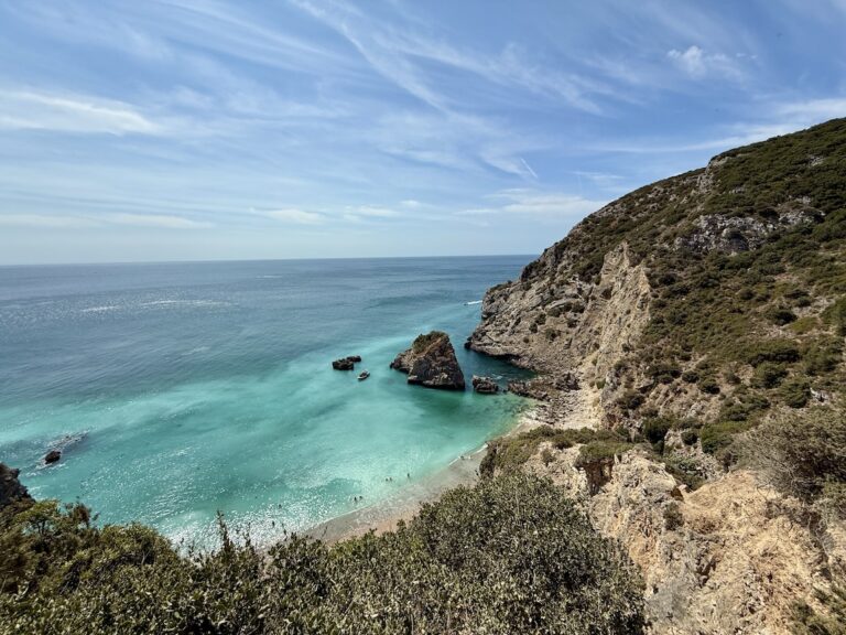 view of Praia Ribeiro do Cavalo with turquoise water and mountains